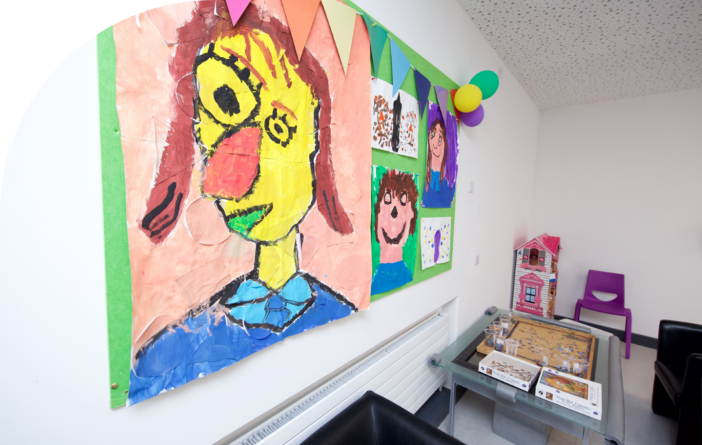 student art displayed in a school on the wall