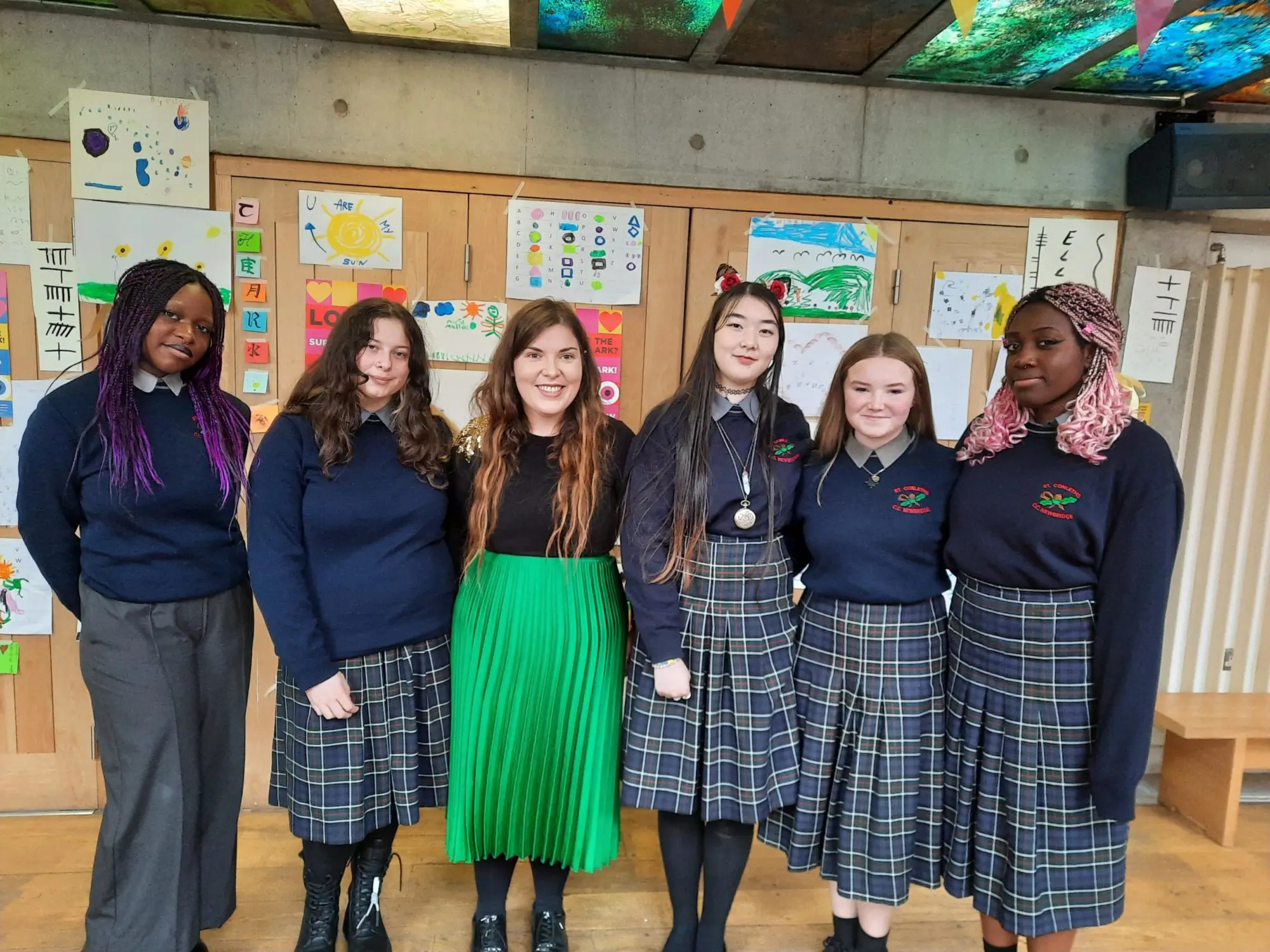 St. Conleth's community school students standing with a mentor at the Ark in Temple Bar