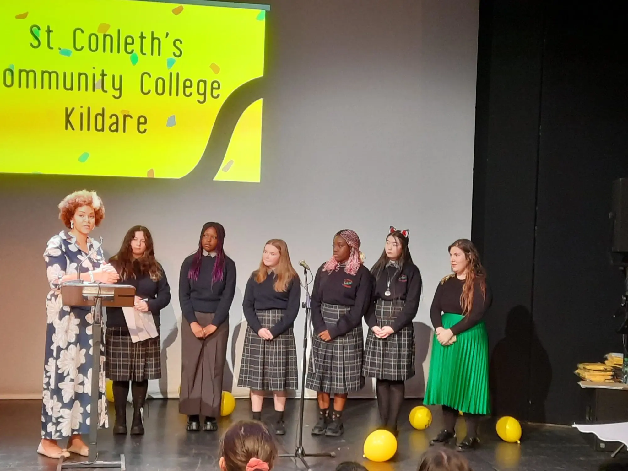 St. Conleth's community school students collecting the yellow flag which represents diversity and culture within schools, on stage 