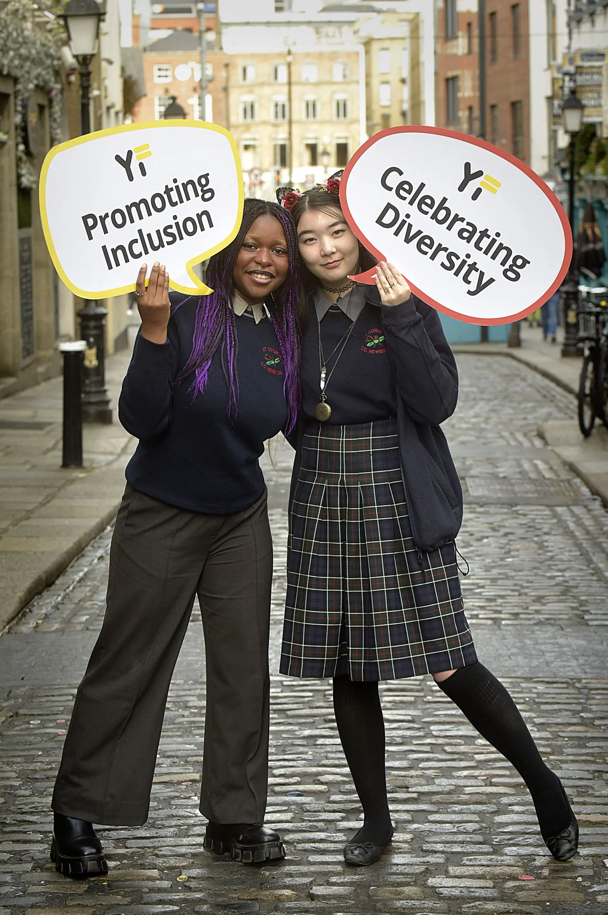 St. Conleth's community school students holding signs saying 'promoting inclusion' and celebrating diversity' at the Ark in Temple Bar 