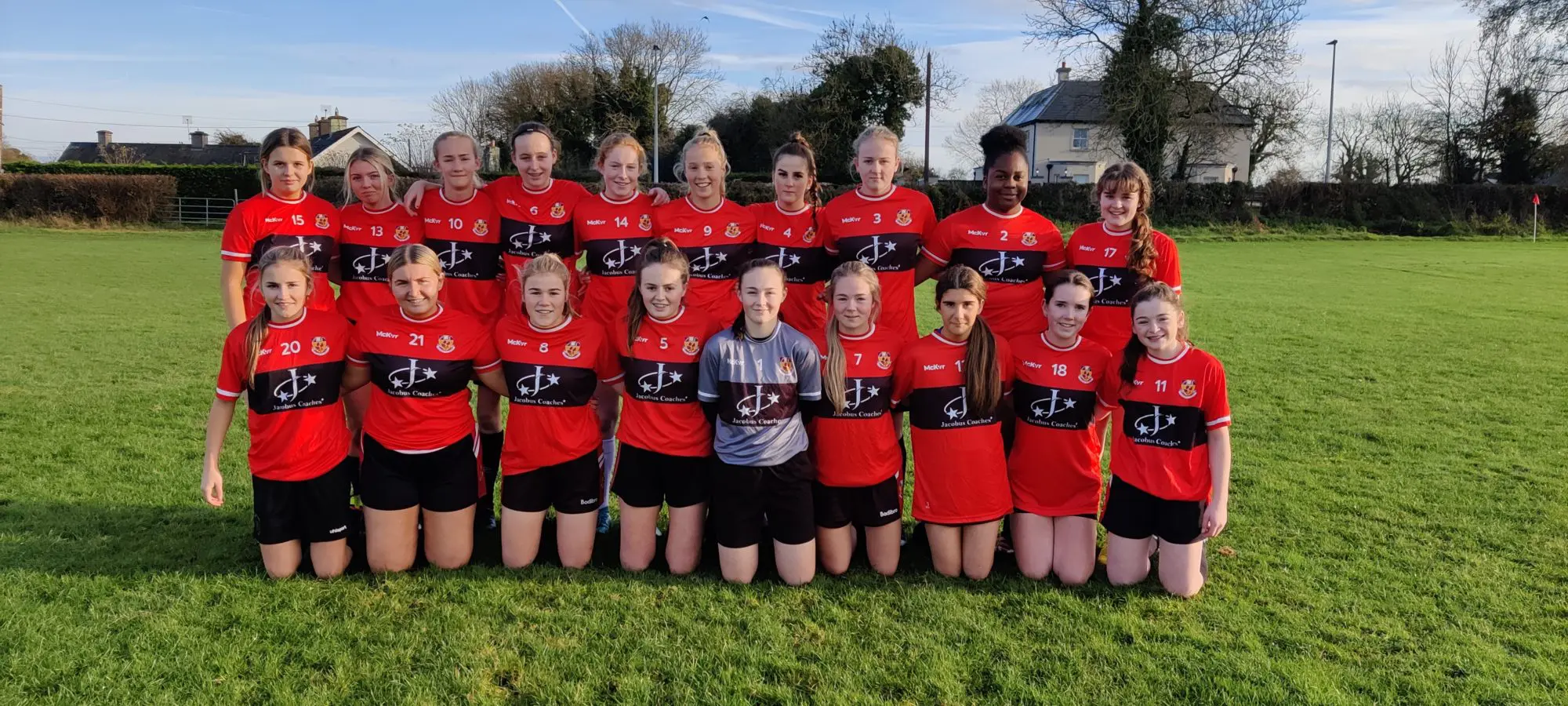 St. Farnans Senior girls soccer team pictured on the pitch after their match