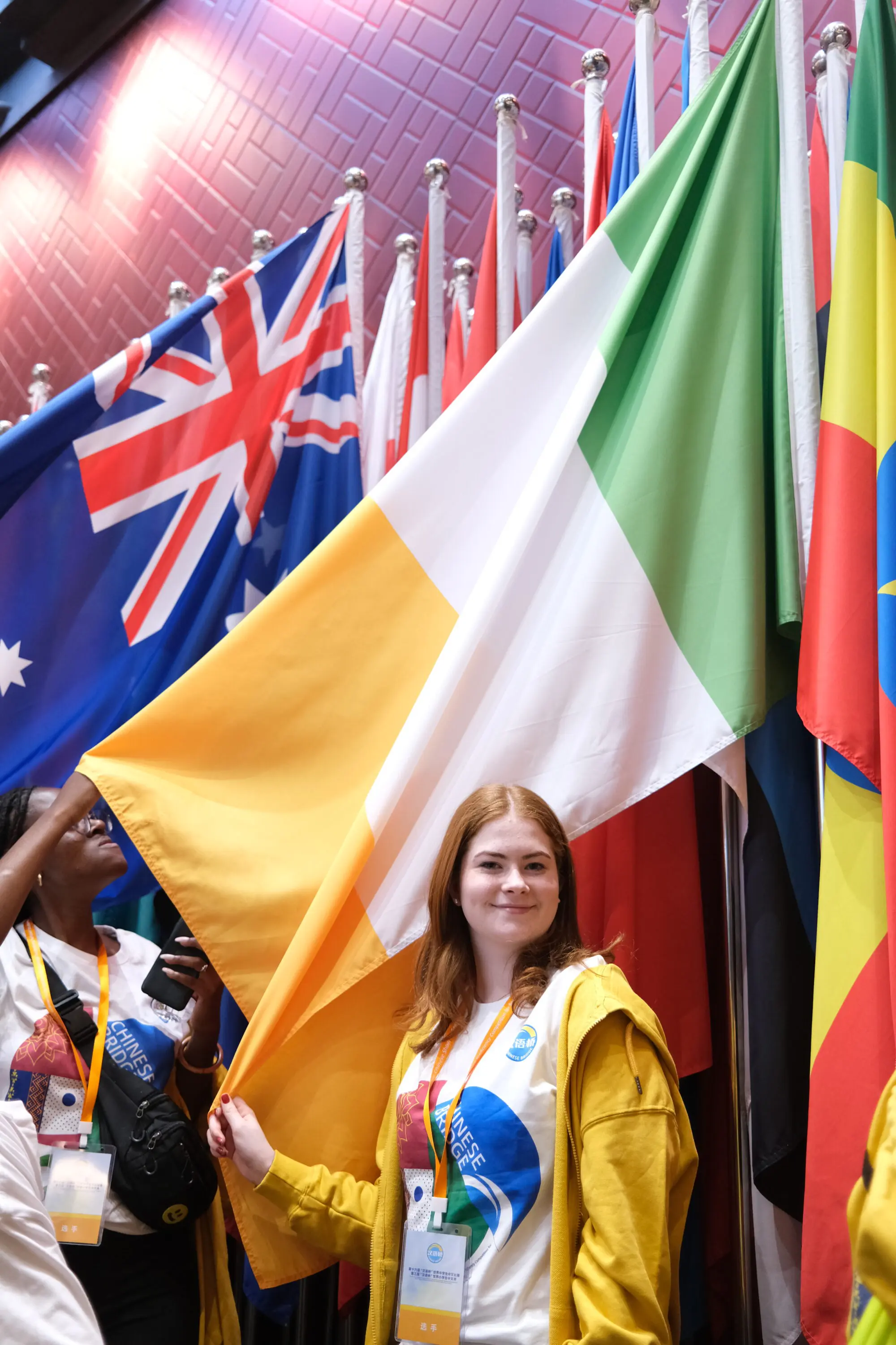 Confey student with the Irish flag whilst in China representing Ireland