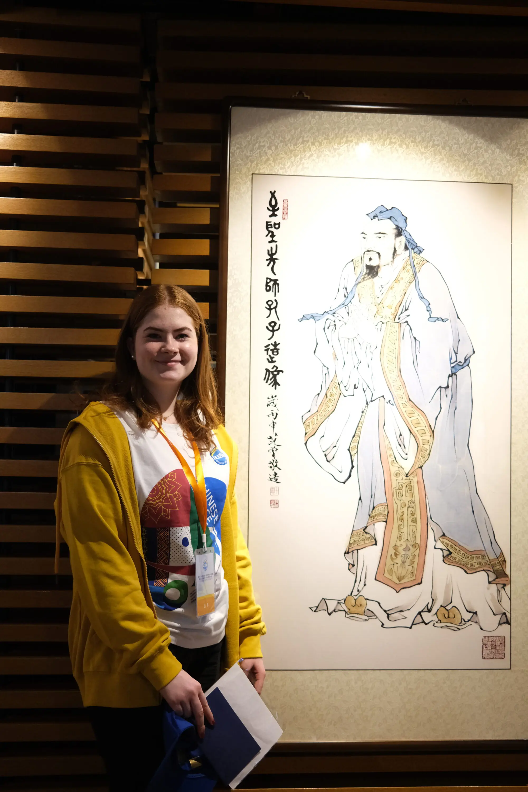 Confey student posing with a painting