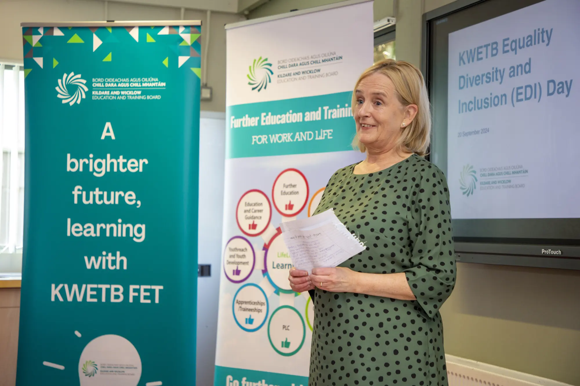 Adult Education Officer, Brenda Lynch presenting against a background of KWETB promotional banners at a KWETB Equality, Diversity and Inclusion (EDI) day